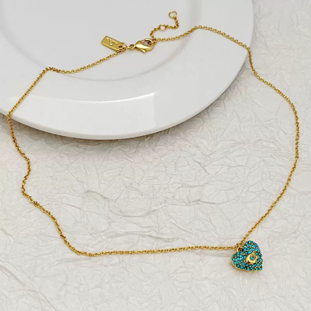 Coach Gold Plated Copper Heart Pendant Necklace Blue Rhinestone Choker